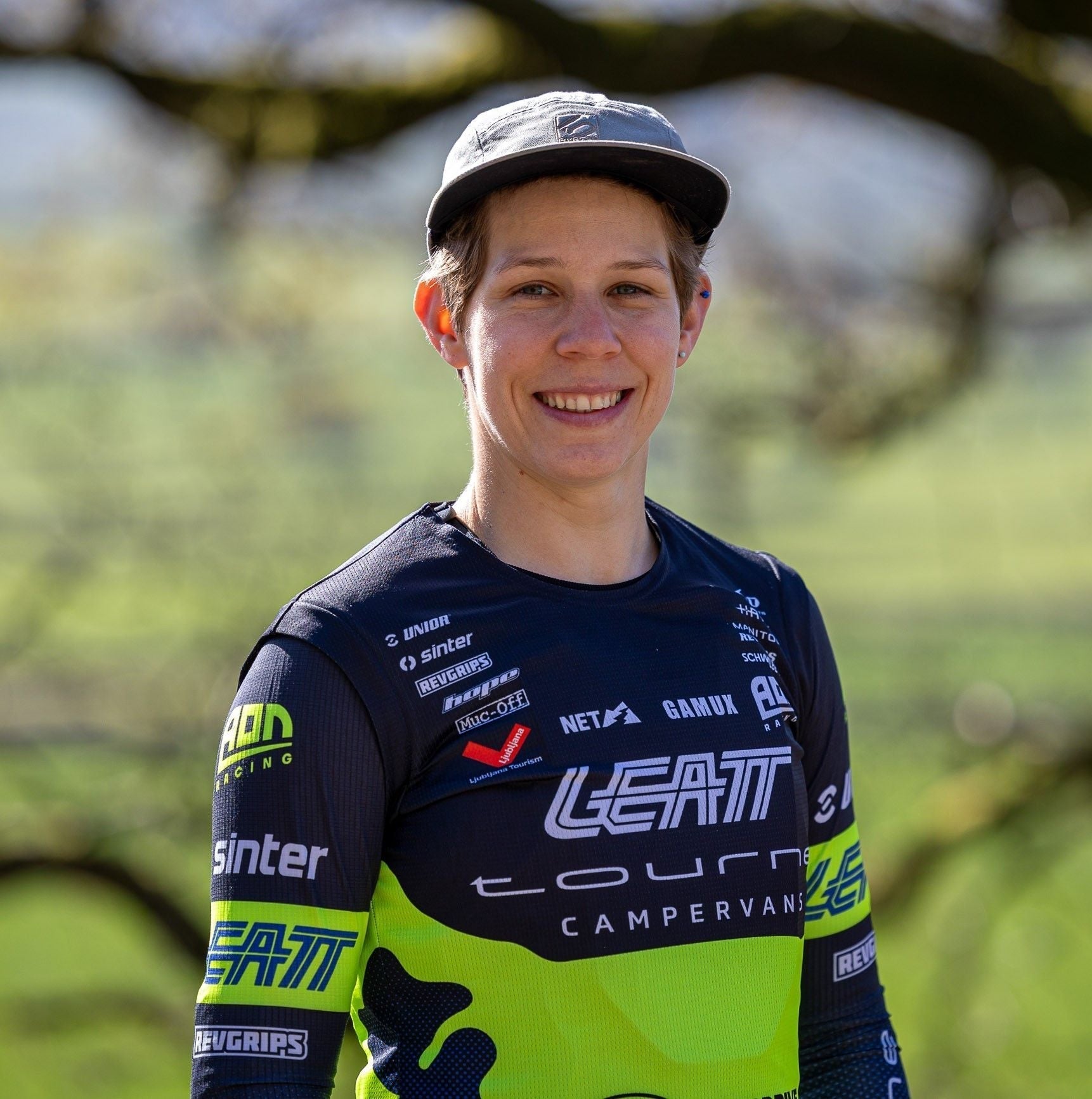 Monika Hrastnik posing in AON Racing kits